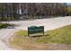 Entrance of Moon Lake Park; signage with amenities in lush green scenery and trees at 10219 Huntley St, New Port Richey, FL 34654