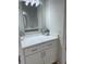 Modern bathroom featuring a white vanity with a marble countertop and neutral walls at 1050 Starkey Rd # 106, Largo, FL 33771