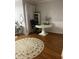 Bright bedroom with a comfortable bed, wood floors, and a large area rug at 1050 Starkey Rd # 106, Largo, FL 33771