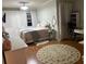 Bright bedroom with a comfortable bed, wood floors, and a large area rug at 1050 Starkey Rd # 106, Largo, FL 33771