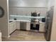 Modern kitchen with stainless steel appliances and ample cabinet space at 1050 Starkey Rd # 106, Largo, FL 33771