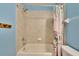 The bathroom features an shower and tub with tile surround at 10606 Shady Falls Ct, Riverview, FL 33578
