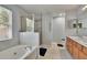Spacious bathroom with a soaking tub, walk-in shower, and a dual sink vanity at 10606 Shady Falls Ct, Riverview, FL 33578