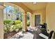Welcoming front porch with cozy seating, decorative welcome sign, and well-maintained landscaping at 10606 Shady Falls Ct, Riverview, FL 33578