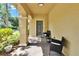 Inviting front porch featuring outdoor seating and a stylish welcome sign at 10606 Shady Falls Ct, Riverview, FL 33578