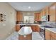 Cozy kitchen featuring a center island, stylish backsplash, and stainless steel appliances at 10606 Shady Falls Ct, Riverview, FL 33578
