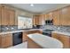 Charming kitchen boasts stainless steel appliances, mosaic backsplash, and lots of natural light at 10606 Shady Falls Ct, Riverview, FL 33578