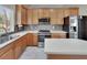Bright kitchen featuring stainless steel appliances, ample counter space, and natural light at 10606 Shady Falls Ct, Riverview, FL 33578