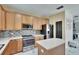 Kitchen with stainless steel appliances, central island, and sleek countertops at 10606 Shady Falls Ct, Riverview, FL 33578