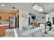Open concept kitchen with stainless appliances, dining area, and living space at 10606 Shady Falls Ct, Riverview, FL 33578