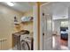 Convenient laundry room with modern washer and dryer, plus shelving for organized storage at 10606 Shady Falls Ct, Riverview, FL 33578