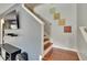 Cozy staircase with wall art, hardwood steps, and gray wall at 10606 Shady Falls Ct, Riverview, FL 33578