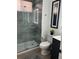 Modern bathroom featuring a stylish glass enclosed shower with a sleek vanity and modern fixtures at 10880 Cory Lake Dr, Tampa, FL 33647
