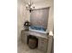 Bathroom vanity with granite countertops and pendant lighting, as well as a decorated makeup space at 10880 Cory Lake Dr, Tampa, FL 33647