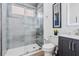 Beautiful bathroom with a large, fully glassed in shower, sleek vanity, and modern fixtures at 10880 Cory Lake Dr, Tampa, FL 33647