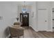 Bright foyer with wood floors, high ceilings, and an elegant chandelier over the front door at 10880 Cory Lake Dr, Tampa, FL 33647