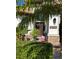 Front door and façade with stone accents, landscaping, and a decorative heart wreath at 10880 Cory Lake Dr, Tampa, FL 33647