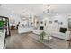 An open-concept living room features an island, modern light fixtures, and neutral tones at 10880 Cory Lake Dr, Tampa, FL 33647