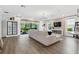 Spacious living room with an accent wall, natural lighting, and an open floor plan at 10880 Cory Lake Dr, Tampa, FL 33647
