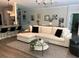 Comfortable living room showcases an open floor plan, natural lighting, and stylish decor at 10880 Cory Lake Dr, Tampa, FL 33647