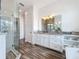 Large bathroom featuring a walk-in shower with white tiled walls at 1204 Derby Ln, Sarasota, FL 34242