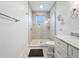 This bathroom features a tiled walk-in shower, a modern sink, and nautical themed wall decorations at 1204 Derby Ln, Sarasota, FL 34242