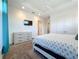 Comfortable bedroom featuring a dresser, closet, and television at 1204 Derby Ln, Sarasota, FL 34242