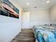 This bedroom features clean white wainscotting and a bright and airy feel at 1204 Derby Ln, Sarasota, FL 34242