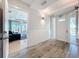 Welcoming foyer featuring a tiled floor and an open doorway to the living area at 1204 Derby Ln, Sarasota, FL 34242
