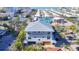 Elegant home with a metal roof, spacious garage, and views of the water at 1204 Derby Ln, Sarasota, FL 34242