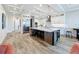 Gourmet kitchen with a large island, stainless steel appliances, and custom cabinets at 1204 Derby Ln, Sarasota, FL 34242