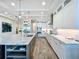 Modern kitchen with stainless steel appliances, island, and a sleek design, perfect for cooking and entertaining at 1204 Derby Ln, Sarasota, FL 34242