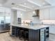 Beautiful kitchen with stainless steel appliances, bar seating, and a wine fridge, perfect for entertaining at 1204 Derby Ln, Sarasota, FL 34242