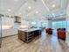 Spacious open-concept kitchen with a large center island, stainless steel appliances, and views to the living area at 1204 Derby Ln, Sarasota, FL 34242
