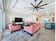 The open living room showcases stylish decor, tray ceilings, and seamless flow to the kitchen at 1204 Derby Ln, Sarasota, FL 34242