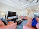 The comfortable living area boasts modern decor, tray ceilings, and seamless flow to other rooms at 1204 Derby Ln, Sarasota, FL 34242