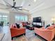 Spacious living room with views, modern furniture, and access to outdoor balcony at 1204 Derby Ln, Sarasota, FL 34242