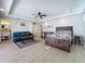 Spacious main bedroom boasts a seating area, an ensuite bathroom, and stylish decor at 1204 Derby Ln, Sarasota, FL 34242