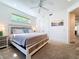 A lovely main bedroom featuring a window view, carpet flooring, and closet at 1204 Derby Ln, Sarasota, FL 34242