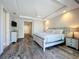 Spacious bedroom with a ceiling fan, dresser, and a king sized bed at 1204 Derby Ln, Sarasota, FL 34242