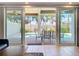Pool and patio with clear glass doors that bring the outdoors in at 1204 Derby Ln, Sarasota, FL 34242