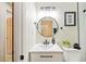 Updated bathroom with white sink and vanity, and decorative lighting fixture at 1206 E Osborne Ave, Tampa, FL 33603