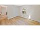 Neutral bedroom with wood look floors and an entryway at 1206 E Osborne Ave, Tampa, FL 33603