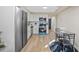 Bright kitchen features stainless steel appliances, white cabinets, and a cozy dining area at 1206 E Osborne Ave, Tampa, FL 33603