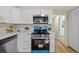 Kitchen featuring stainless steel appliances and modern cabinets at 1206 E Osborne Ave, Tampa, FL 33603