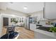 Modern kitchen featuring stainless steel appliances and an adjacent dining area at 1206 E Osborne Ave, Tampa, FL 33603