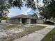 A single-story home with a two-car garage and welcoming front entrance in a serene neighborhood at 15421 Shoal Haven Pl, Ruskin, FL 33573
