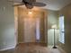 Inviting entryway with natural light, decorative ceiling fan, and wood-look flooring at 15421 Shoal Haven Pl, Ruskin, FL 33573
