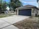 Lovely single-story home with a two-car garage and a spacious driveway, offering convenience and ample parking at 15421 Shoal Haven Pl, Ruskin, FL 33573