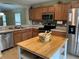 Efficient kitchen layout, stainless steel appliances, and an island at 15421 Shoal Haven Pl, Ruskin, FL 33573